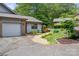 Charming home with a well-manicured lawn, complemented by lush greenery and a private garage at 2750 Victory Ct, Fort Mill, SC 29715