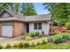 Home's front exterior featuring a brick facade, front door, front yard landscaping, and a side deck at 2750 Victory Ct, Fort Mill, SC 29715