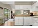 Efficient kitchen design with white appliances, a dishwasher, and a seamless connection to the outdoor patio at 2750 Victory Ct, Fort Mill, SC 29715