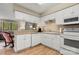 Functional kitchen with white cabinets, granite counters, and an open view to the living area at 2750 Victory Ct, Fort Mill, SC 29715