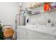 Bright laundry room equipped with a washer, dryer, and shelving for storage at 2750 Victory Ct, Fort Mill, SC 29715