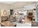 Open-concept living area flowing into the kitchen with hardwood floors and charming decorative details at 2750 Victory Ct, Fort Mill, SC 29715