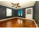 Bedroom features hardwood floors, ceiling fan, natural light and closet space at 2905 Grimes St, Charlotte, NC 28206