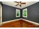 Bedroom featuring hardwood floors, and two windows letting in natural light at 2905 Grimes St, Charlotte, NC 28206