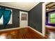 This cozy living room features hardwood floors, dark walls, and trim at 2905 Grimes St, Charlotte, NC 28206