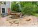 Tranquil backyard pond with a waterfall feature, stone accents, and a relaxing bench area perfect for quiet reflection at 2907 Notchview Ct, Charlotte, NC 28210
