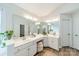 Bathroom featuring dual sinks, vanity with seating, and neutral decor at 2907 Notchview Ct, Charlotte, NC 28210