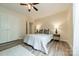 Bedroom with hardwood floors, neutral walls, and a ceiling fan, offering a peaceful retreat at 2907 Notchview Ct, Charlotte, NC 28210