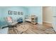 Baby room with a crib, rocking chair, and playful decorations at 2907 Notchview Ct, Charlotte, NC 28210