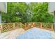 Wooden deck with geometric railings and a patterned rug, perfect for outdoor relaxation at 2907 Notchview Ct, Charlotte, NC 28210