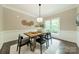 Dining room with rustic wooden table and modern chairs at 2907 Notchview Ct, Charlotte, NC 28210