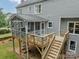 Elevated deck and screened in porch of a grey two-story house at 2907 Notchview Ct, Charlotte, NC 28210