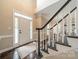 Bright foyer with hardwood floors, stairs, and natural light at 2907 Notchview Ct, Charlotte, NC 28210