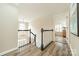 Upstairs hallway with wood floors and a view of the foyer at 2907 Notchview Ct, Charlotte, NC 28210
