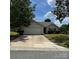 Charming one-story home featuring an attached garage and well-maintained front yard at 3012 Longspur Dr, Matthews, NC 28105