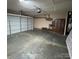 Spacious two-car garage with plenty of room for vehicles and storage at 3012 Longspur Dr, Matthews, NC 28105