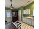 Kitchen with white cabinetry, laminate countertops, stainless steel appliances and dark tile floors at 3012 Longspur Dr, Matthews, NC 28105