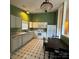 Kitchen with white cabinetry, laminate countertops, stainless steel appliances and dark tile floors at 3012 Longspur Dr, Matthews, NC 28105