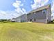 Spacious backyard featuring lush green grass and views of the home's exterior at 3023 Ballester Rd, Fort Mill, SC 29707