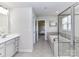 Bathroom with tub, shower, and gray vanity offers a modern and functional design for comfortable living at 3023 Ballester Rd, Fort Mill, SC 29707