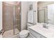 Modern bathroom with a glass door shower, white cabinets, and sleek fixtures at 3023 Ballester Rd, Fort Mill, SC 29707