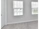Bedroom with neutral walls and floors, illuminated by natural light, offers a serene and comfortable space at 3023 Ballester Rd, Fort Mill, SC 29707