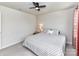Comfortable bedroom with neutral walls, a ceiling fan, and a bed topped with decorative pillows and patterned bedding at 3023 Ballester Rd, Fort Mill, SC 29707
