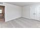 Spacious bedroom with plush carpeting and a double door closet, offering ample storage space at 3023 Ballester Rd, Fort Mill, SC 29707