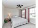 Cozy bedroom featuring a ceiling fan, a comfortable bed, and plenty of natural light from the windows at 3023 Ballester Rd, Fort Mill, SC 29707