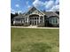 Community clubhouse featuring an entrance with large white pillars, windows, and landscaping at 3023 Ballester Rd, Fort Mill, SC 29707