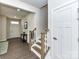 Welcoming entryway with hardwood floors, stairs and white door offers a glimpse into a beautifully designed home at 3023 Ballester Rd, Fort Mill, SC 29707