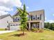 Beautiful two-story home featuring well-kept lawn and landscaping at 3023 Ballester Rd, Fort Mill, SC 29707