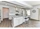 A well-lit kitchen with gray cabinets, granite countertops, pendant lighting, and a stylish island at 3023 Ballester Rd, Fort Mill, SC 29707