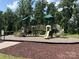 Community playground featuring slides, climbing structures and a bridge, surrounded by trees at 3023 Ballester Rd, Fort Mill, SC 29707