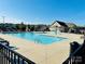Community pool with ample seating and a splash pad for Gathering fun at 3023 Ballester Rd, Fort Mill, SC 29707
