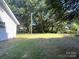 A large, well-maintained backyard lawn with mature trees, offering serene outdoor space at 345 Mountain View St, Gastonia, NC 28052