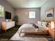 Staged bedroom with natural light, modern furniture, and neutral decor for a serene retreat at 345 Mountain View St, Gastonia, NC 28052