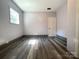 Bedroom featuring wood floors, neutral walls, and abundant natural light through a window at 345 Mountain View St, Gastonia, NC 28052