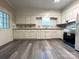 Well-lit kitchen with white cabinets and modern appliances at 345 Mountain View St, Gastonia, NC 28052