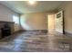 Spacious living room includes a fireplace, hardwood floors, and an exterior door at 345 Mountain View St, Gastonia, NC 28052