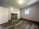 An inviting living room features hardwood floors and a quaint fireplace at 345 Mountain View St, Gastonia, NC 28052