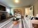 Living room features a fireplace, a bookshelf, and comfortable seating at 345 Mountain View St, Gastonia, NC 28052