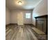 Bright and spacious living room with wood floors and a classic fireplace at 345 Mountain View St, Gastonia, NC 28052