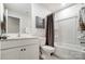 A well-lit bathroom featuring a shower-tub combo, a single sink vanity, and neutral decor at 3844 Cheyney Park Dr, Charlotte, NC 28269