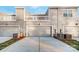 Three car garage and exterior view of the home featuring gray siding and clean landscaping at 3844 Cheyney Park Dr, Charlotte, NC 28269