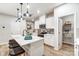 Modern kitchen featuring white cabinets, quartz countertops, and pantry at 3844 Cheyney Park Dr, Charlotte, NC 28269