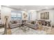 Spacious living room featuring a cozy sectional, modern decor, and ample natural light at 3844 Cheyney Park Dr, Charlotte, NC 28269