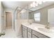 A primary bathroom features a glass shower and dual vanities at 3936 Cheyney Park Dr, Charlotte, NC 28269