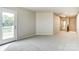 A bedroom featuring neutral walls and soft carpeting leading to an outdoor balcony at 3936 Cheyney Park Dr, Charlotte, NC 28269