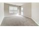 A bright bedroom features neutral walls and soft carpeting at 3936 Cheyney Park Dr, Charlotte, NC 28269